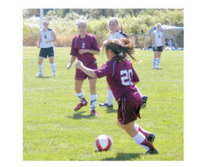Lakewood Legacy captain Maria Smith maneuvers her way through defenders.