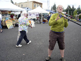 Allison Sayre demonstrates the hoola hoop at the Arlington Farmers Market this summer. The market will have some extra special activities this Saturday as part of the new Arlington Community Day which celebrates all things Arlington.