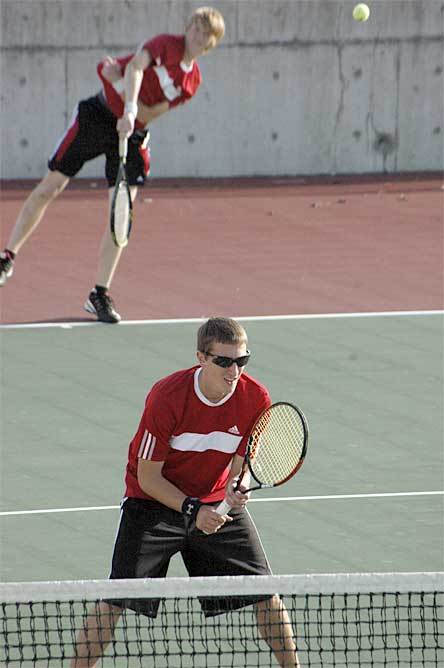 Marysville-Pilchuck's No. 1 doubles team of Jared Rumsey and Jake Hereth readies to serve and for a service return from Arlington.