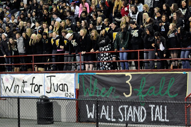 Marysville Getchell students and fans hang signs honoring three students who were involved in an Oct. 24 car crash