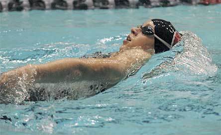 Freshman Hannah Taylor swims the backstroke portion of the 200-yard individual medley race.