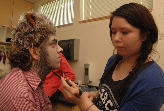 Arts & Technology High School junior Nathan Parkhurst receives a makeup touchup from freshman Jacy Parks on May 7.