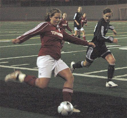Junior forward Mady Schoonover brings the ball up the right side versus the host Snohomish defense September 29.