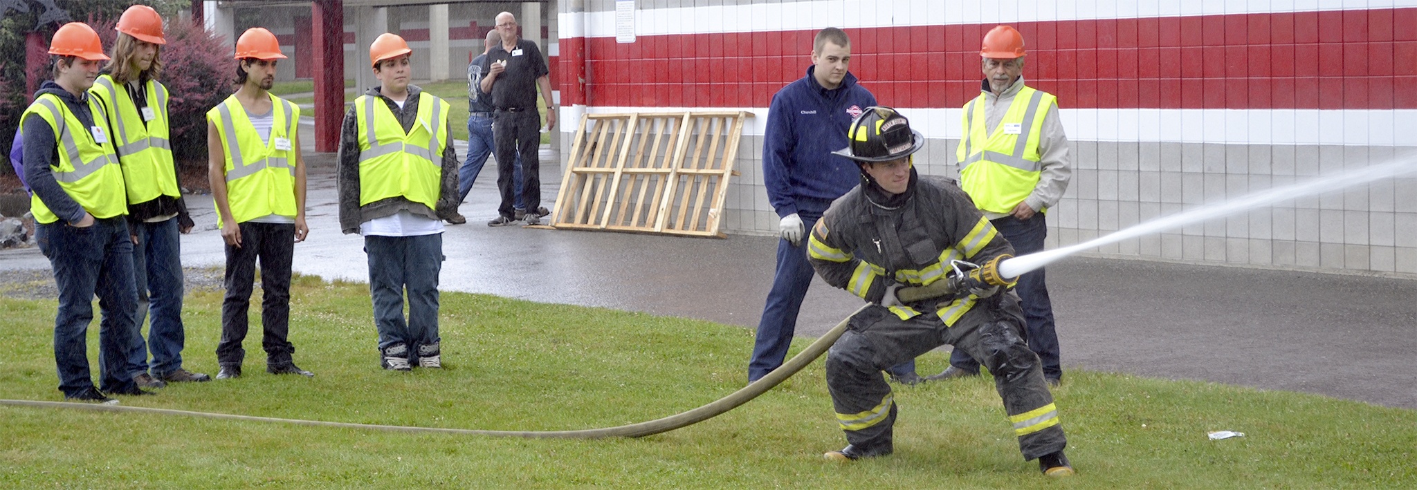 Students learned how to spray a fire hose at the event.
