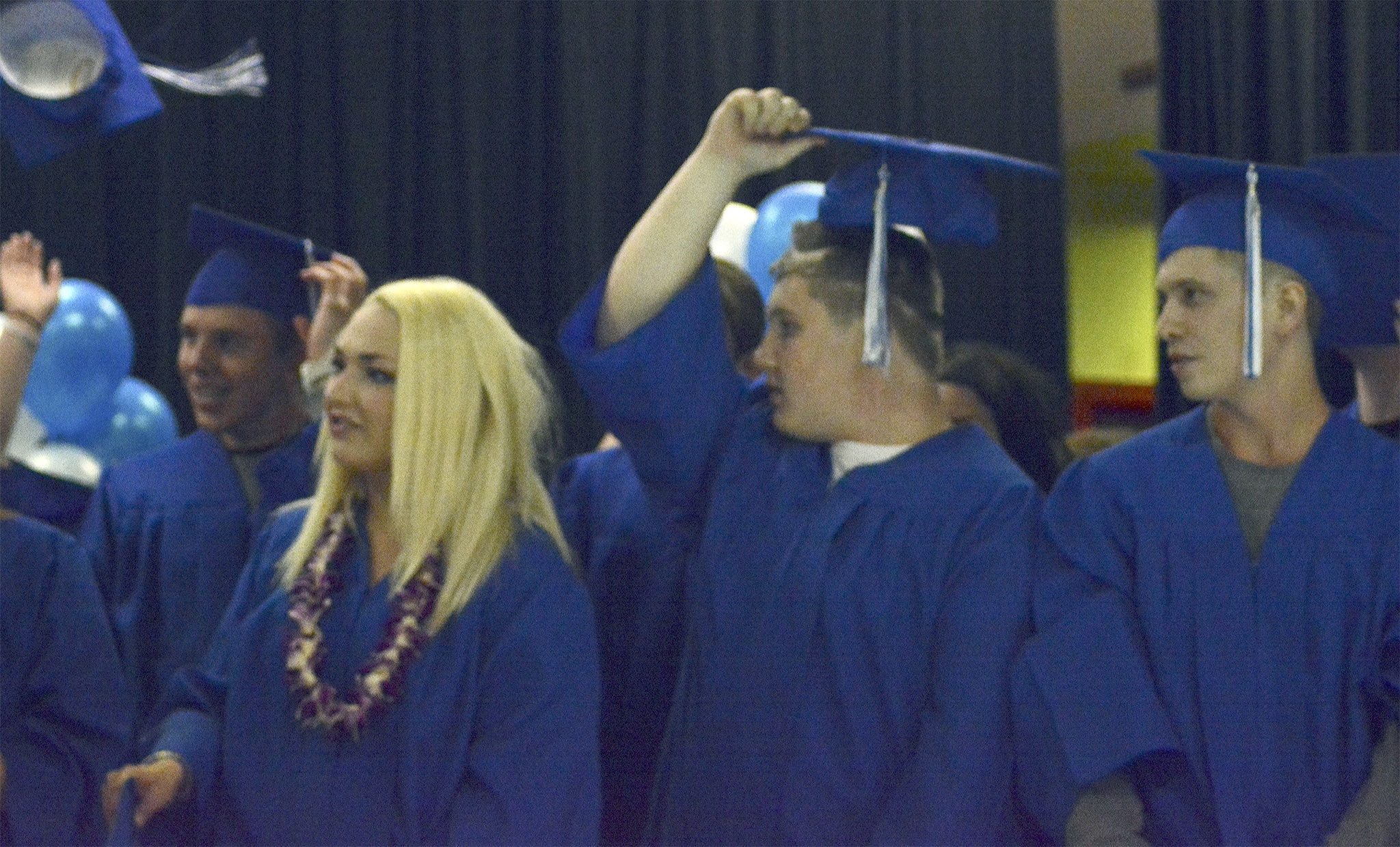 Marysville Mountainview students toss their caps in triumph after the graduation ceremoney.