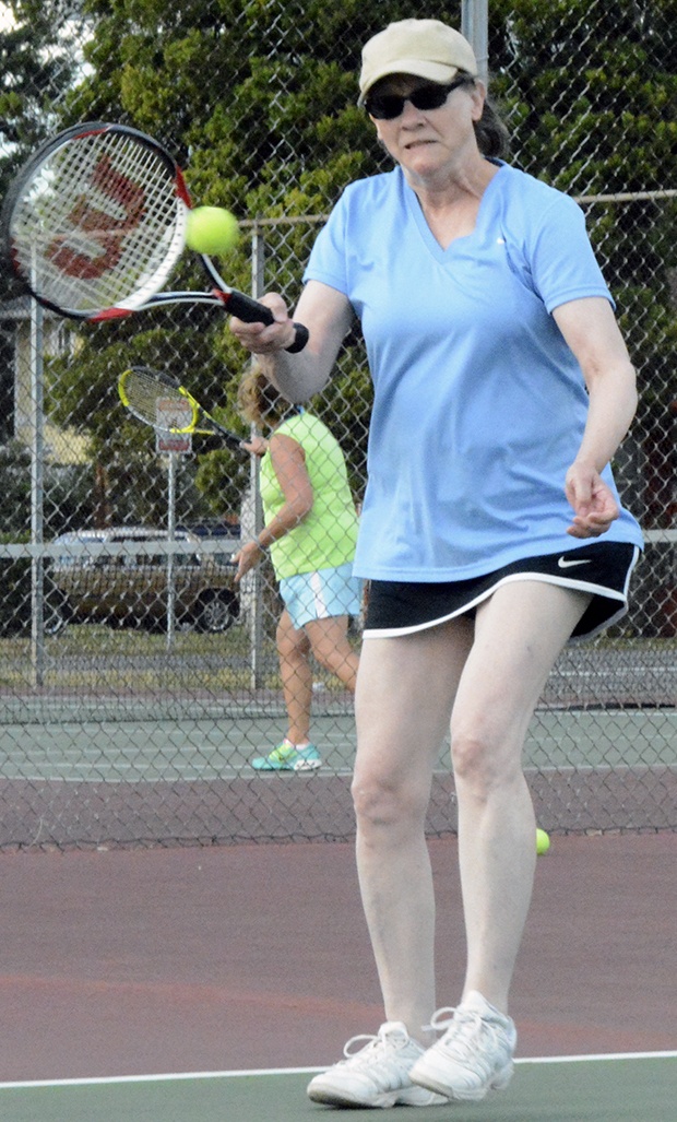 Brandon Adam/Staff PhotoStudent Karen Knudson returns a serve.