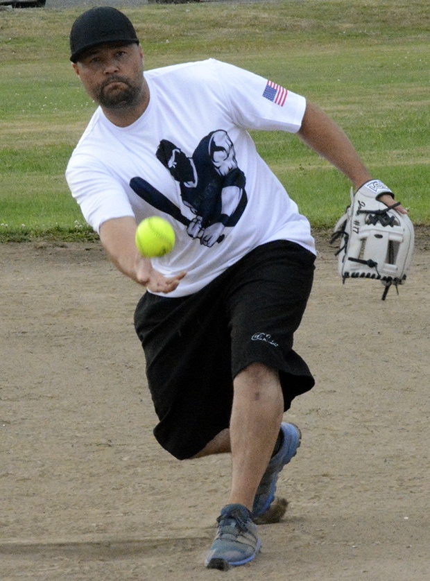 Brandon Adam/Staff PhotoKenny Jobe delivers a pitch during a recreational mens softball game in Marysville.