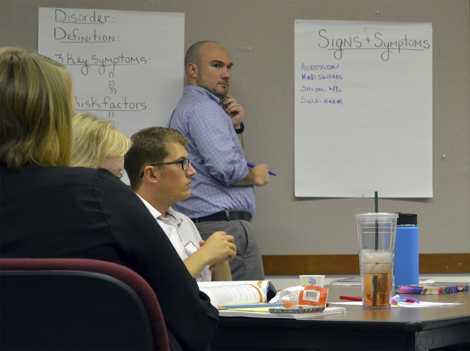 Josh Webb listens to participants at the mental health seminar he put on this week.