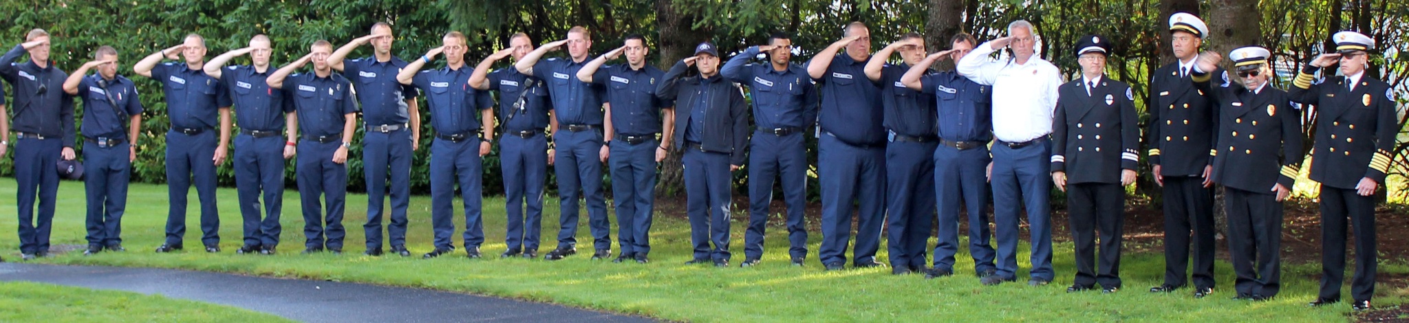 Courtesy PhotoMarysville firefighters and police officers salute the fallen during the 15th anniversary of the Sept. 11