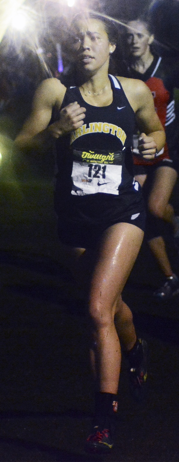 Brandon Adam/Staff PhotoAn Arlington runner during the girls race at the 10th annual Twilight Invitational.