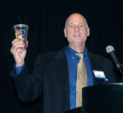Snohomish County Prosecutor Mark Roe urges attendees of the annual ‘Voices of Victims’ fundraising breakfast to skimp on a few of their less essential expenditures to help support Families and Friends of Violent Crime Victims.