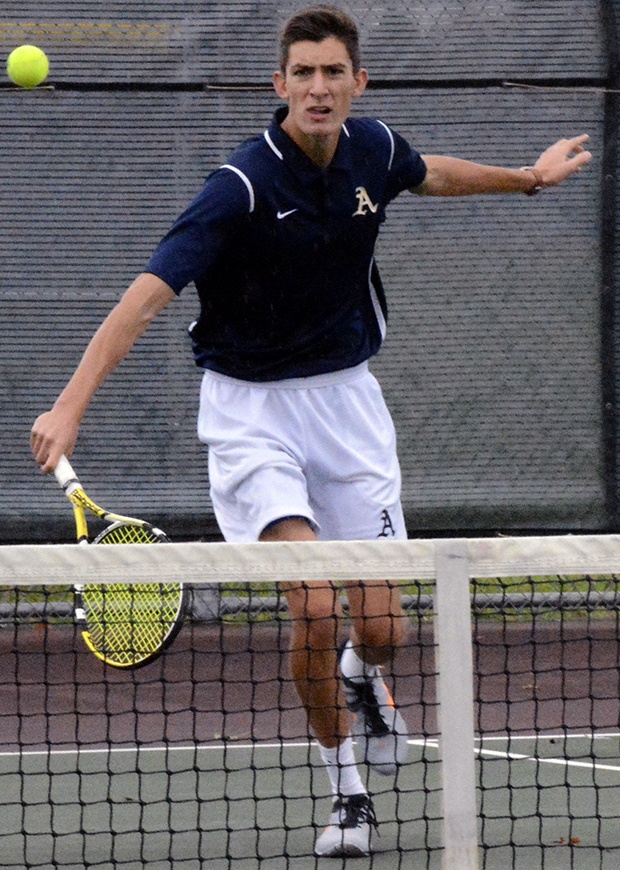 Brandon Adam/Staff PhotoConnor Guthrie of Arlington finishes a backhand.