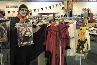Marysville Goodwill “costume coordinator” Enrique Garcia will sell you a vampire costume just like his