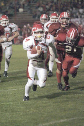 Senior running back Travis Sanderson breaks away from the Stanwood defense for an 18-yard scoring run.