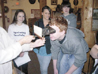 Arlington High School drama students tour the Stillaguamish Valley Pioneer Museum with Harry and Ruth Yost recently.  The students
