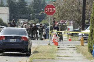Members of the Snohomish County SWAT team arrive on the scene of a standoff at a Marysville apartment near the intersection of Columbia Avenue and Ninth.