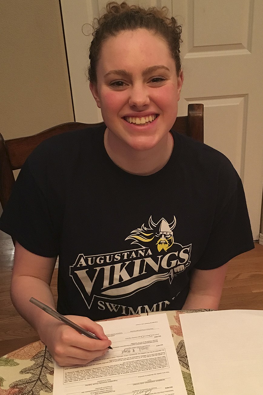 Brandon Adam/Staff Photo                                Marysville-Pilchuck senior Abby Magee signs her letter of intent to swim for Augustana University in Sioux Fall, SD.