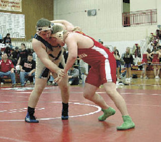 Tomahawk senior Ricky Dschaak and Arlington heavyweight Bryant Dickerson go way back