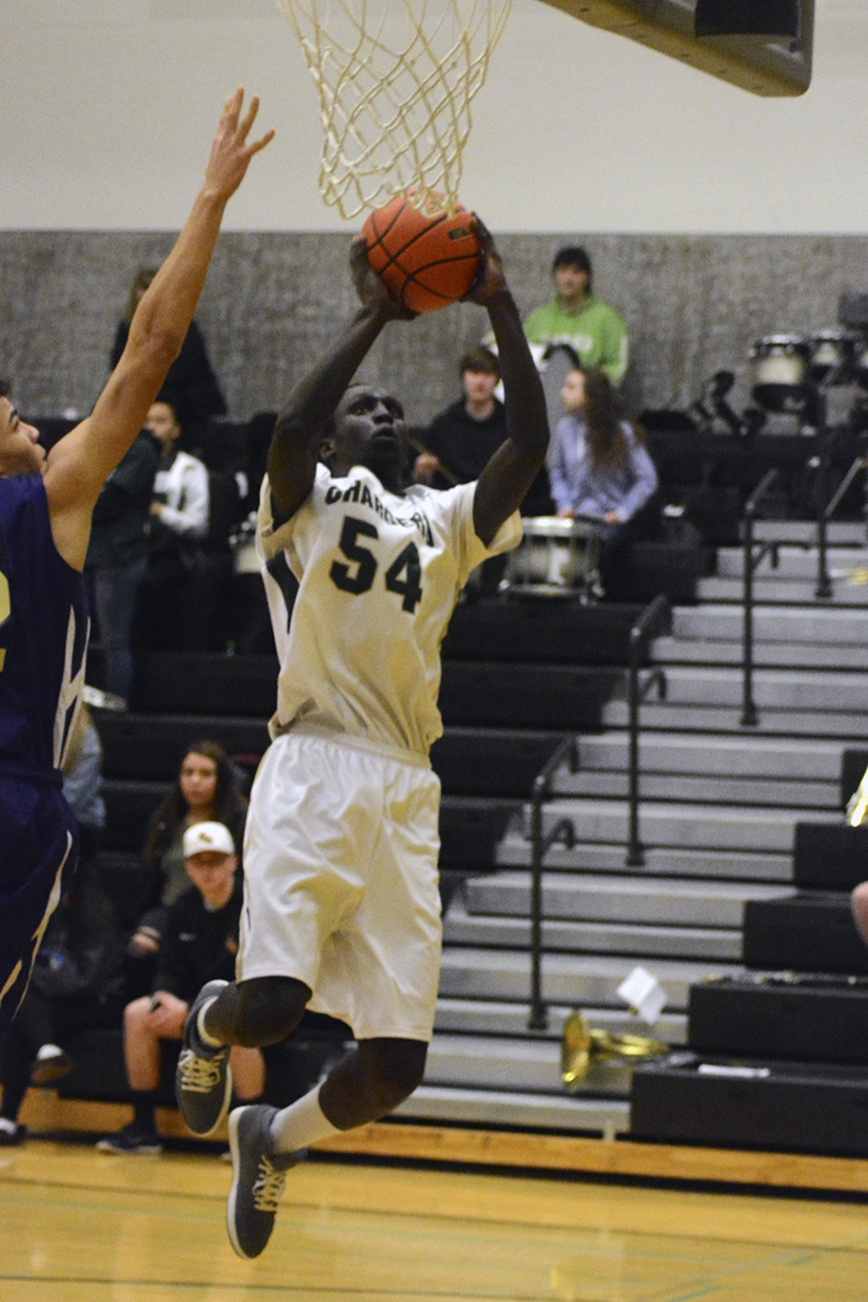 Marysville Getchell&rsquo;s Jalang William jumps for layin. Brandon Adam/Staff Photo