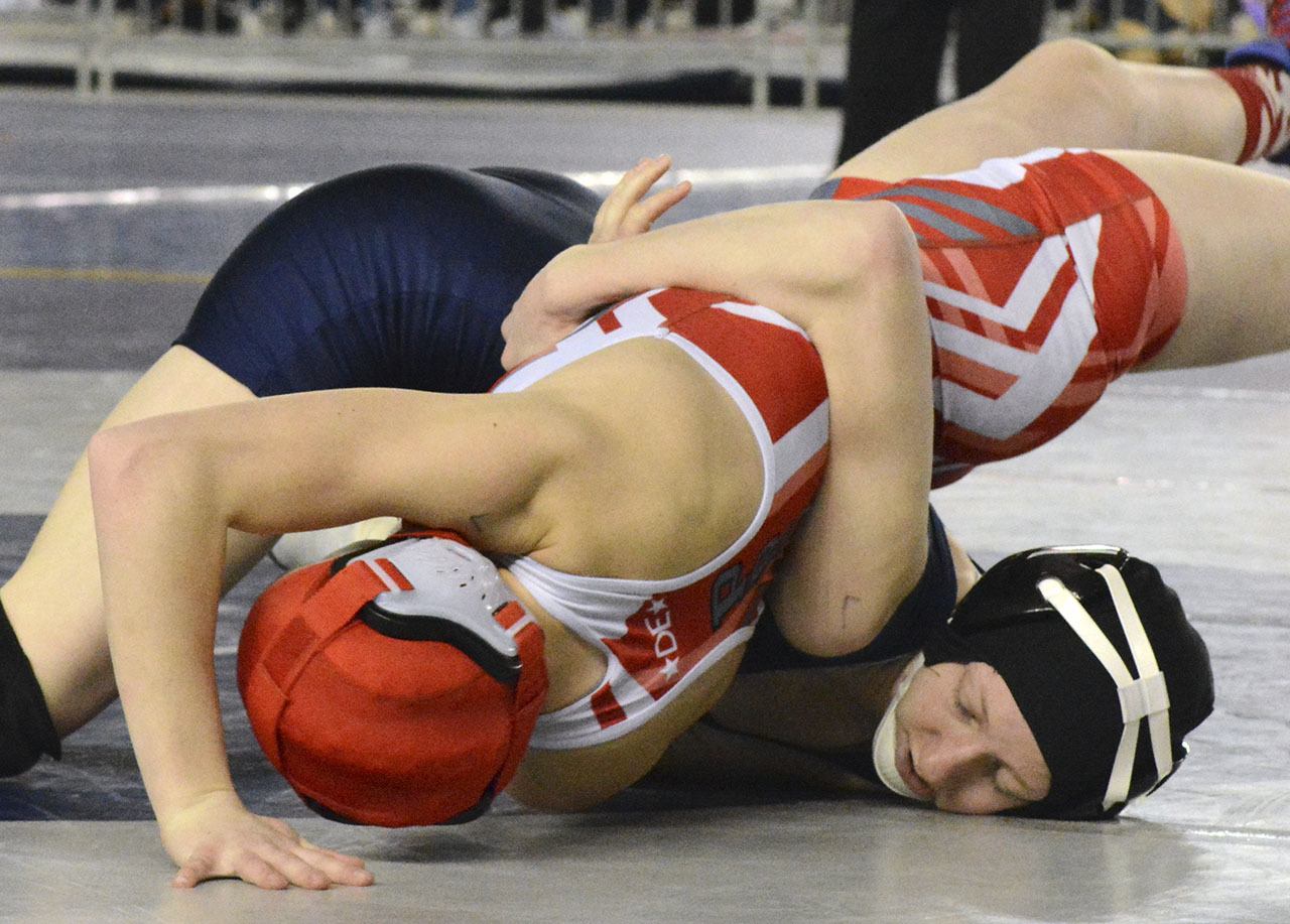 Arlington&rsquo;s Jordynn Mani works for a pin in her first-round match at the girls wrestling state tournament. Brandon Adam/Staff Photo