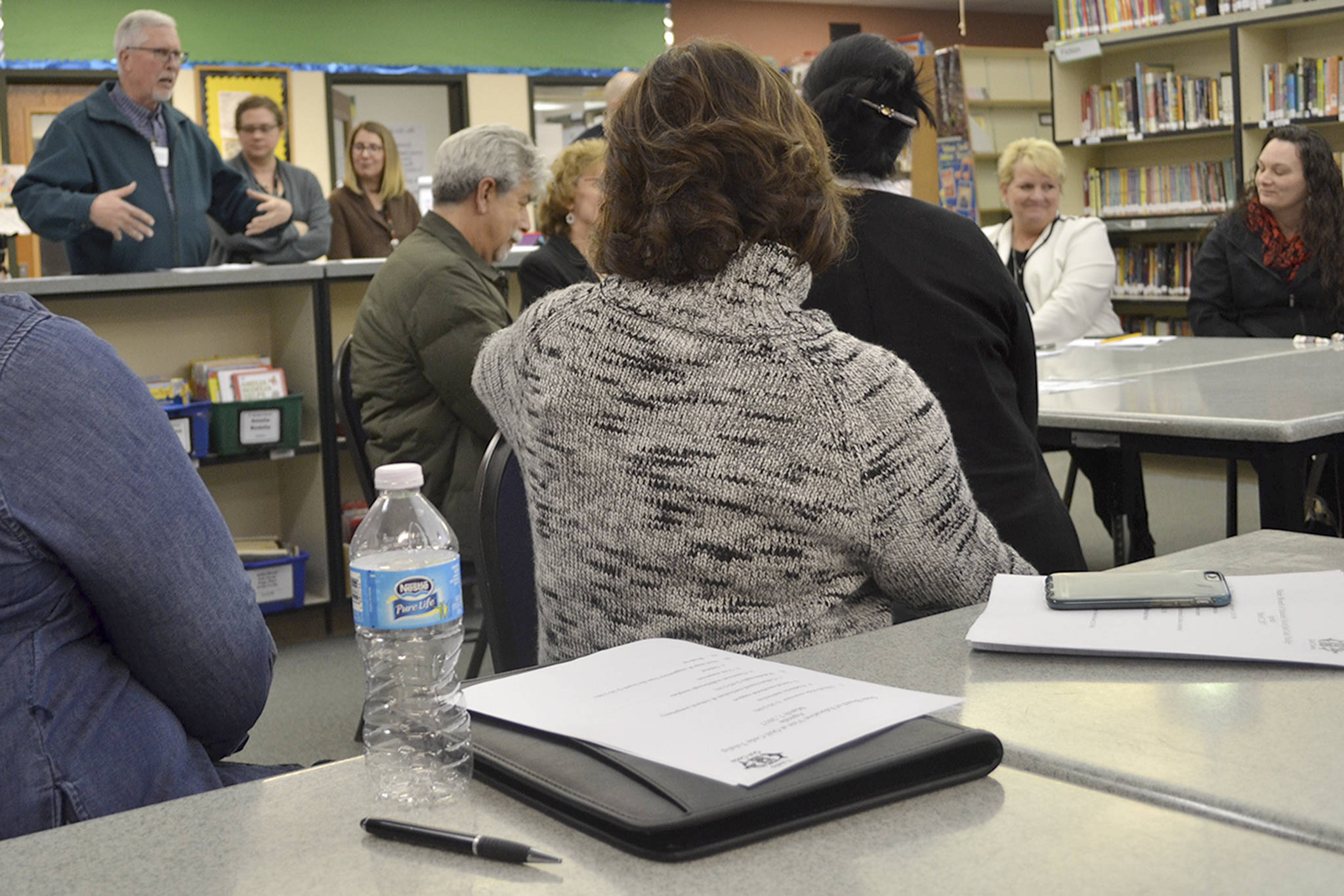 Marysville School Board president Pete Lundberg talks with educators at the meeting with the State Board of Education. (Steve Powell/Staff Photo)