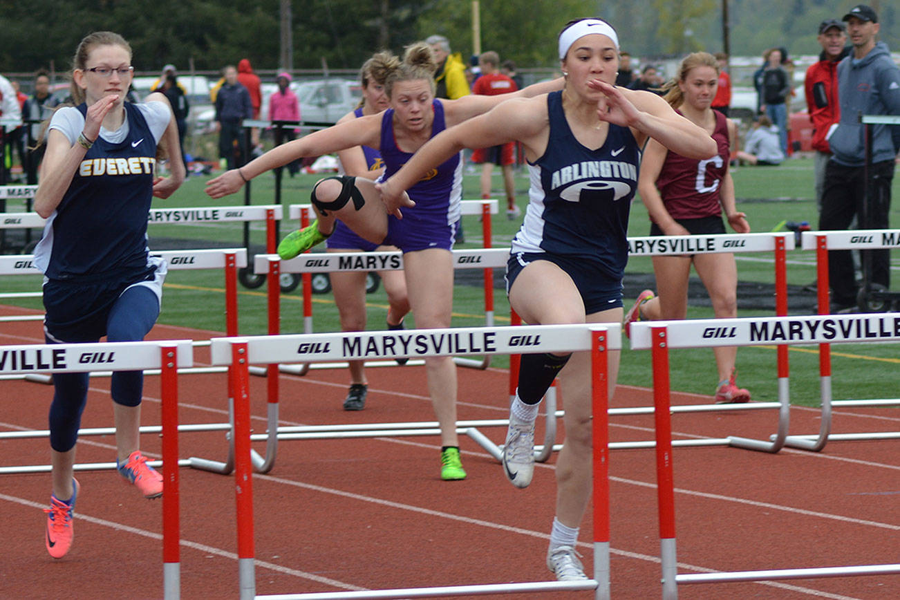Sidney Trinidad of Arlington wins the hurdles at a meet in Marysville earlier this season. She also won both hurdles events at the Wesco North Championships in Oak Harbor. (Steve Powell/File Photo)