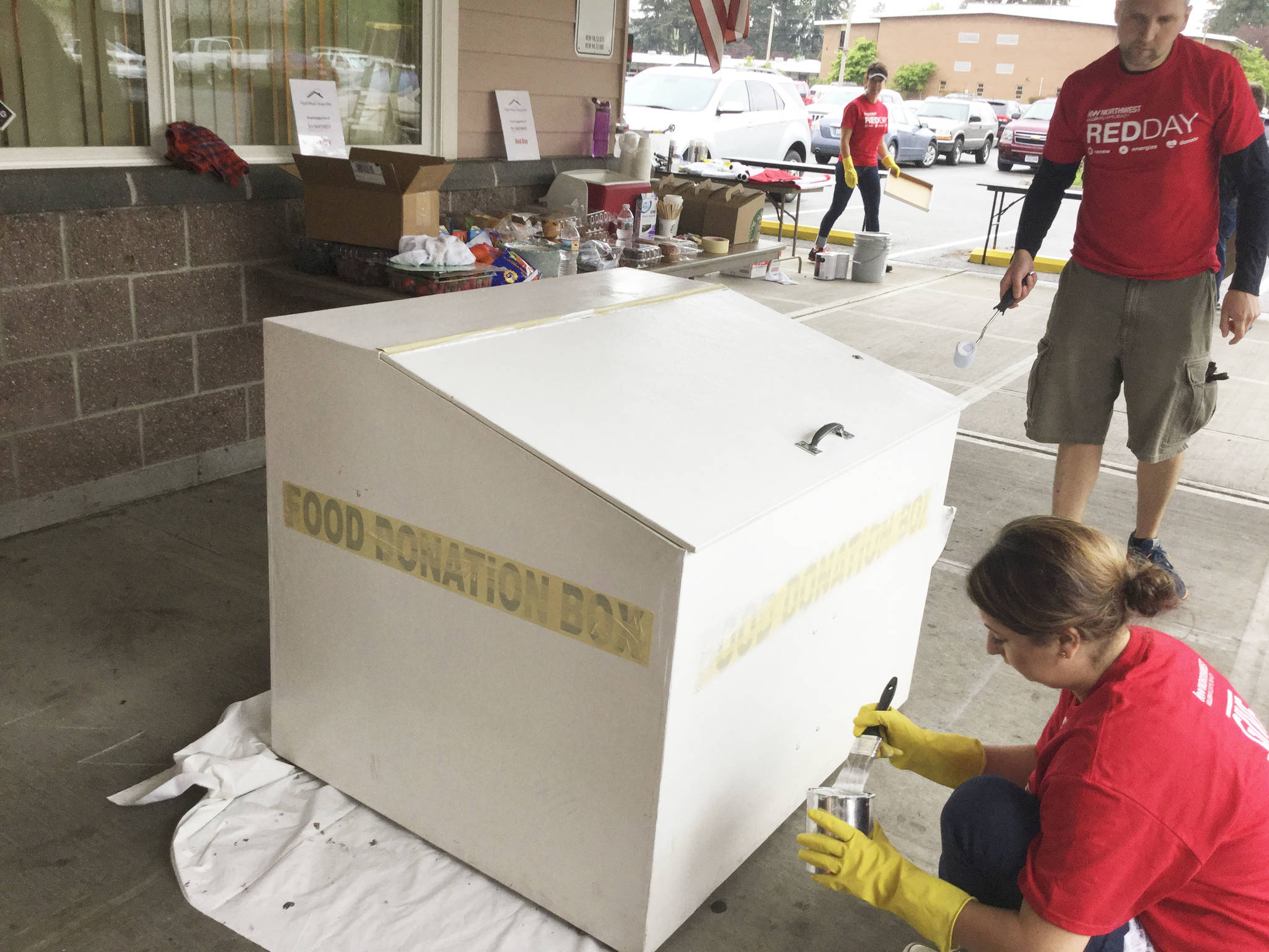 Realty workers give food bank a Red Day makeover