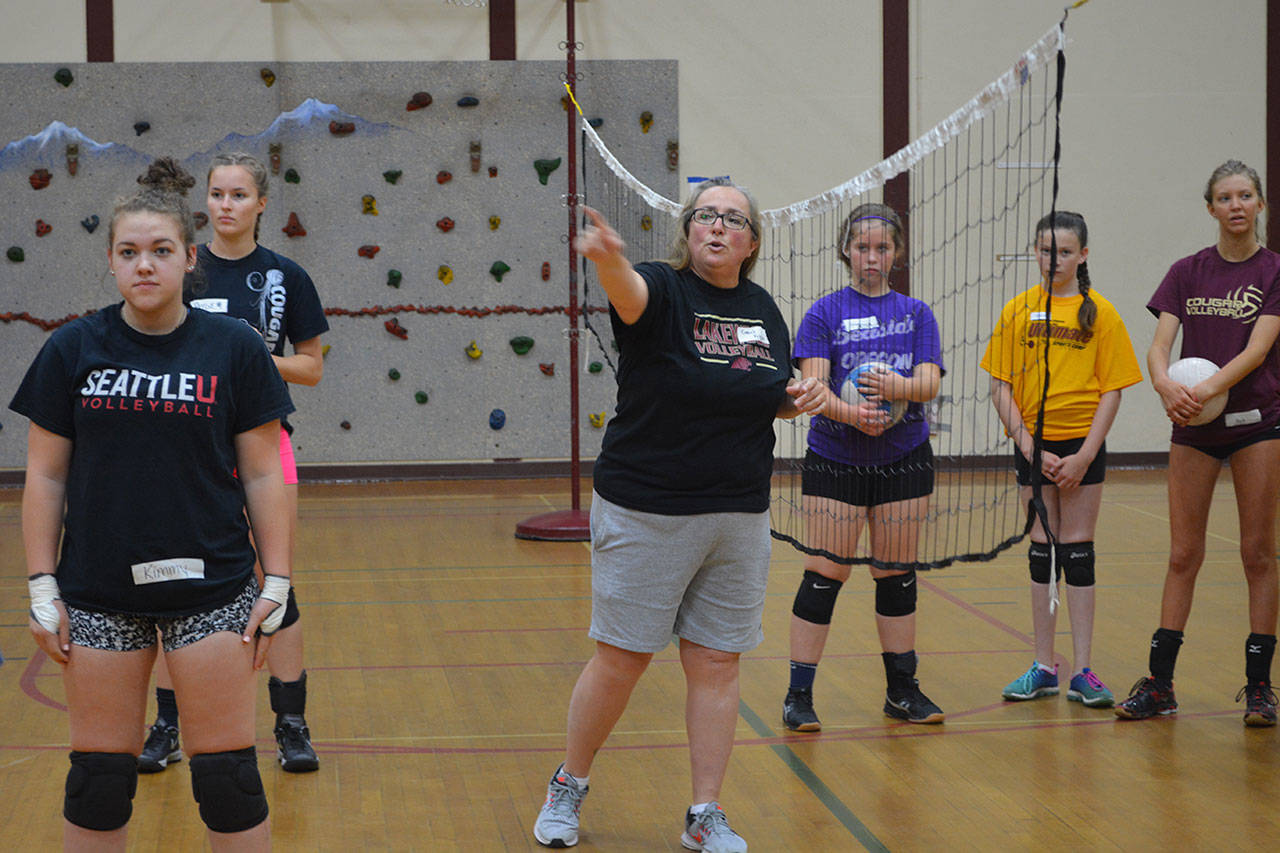 Recently retired volleyball coach coaching volleyball this summer