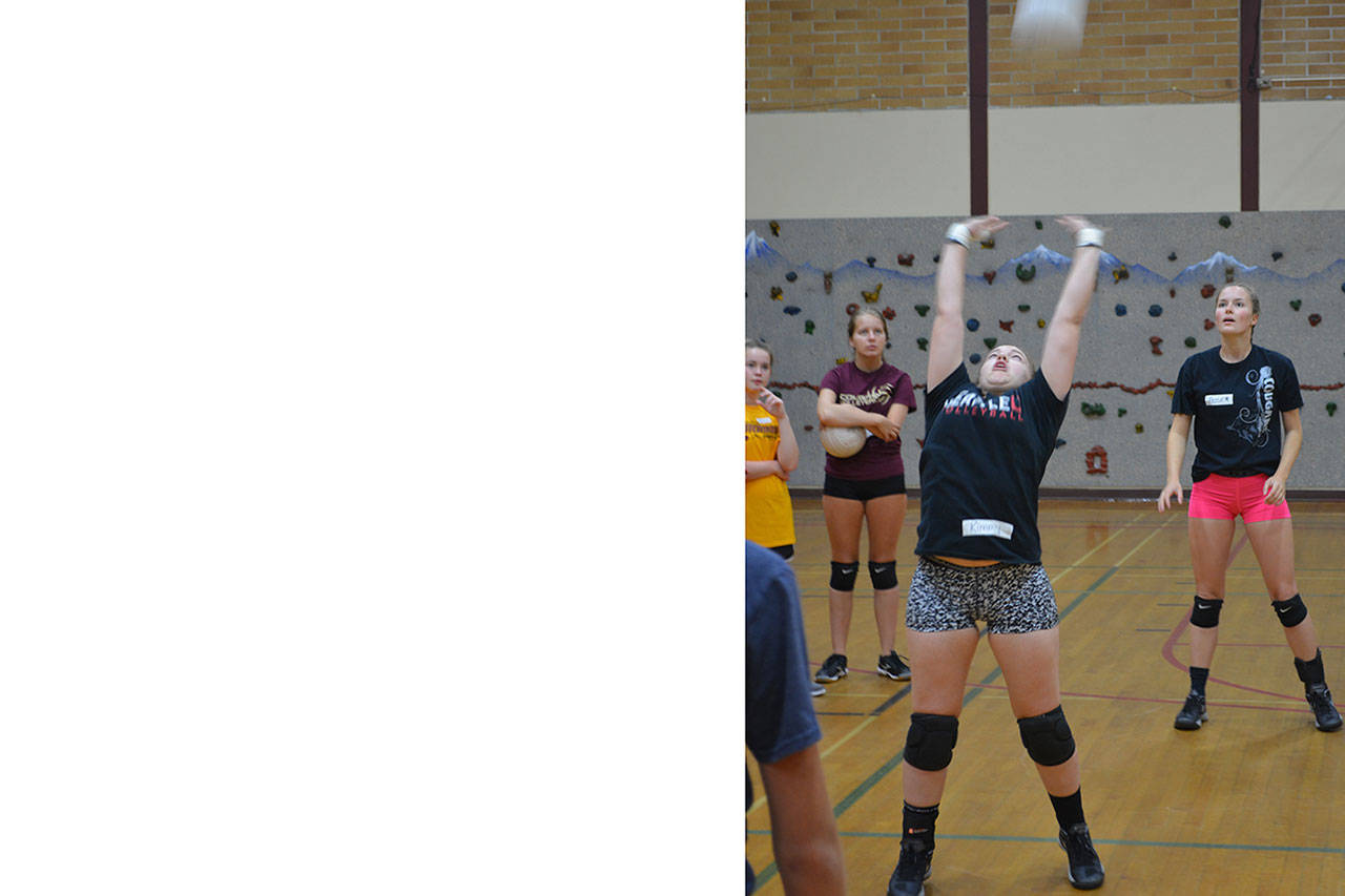 Recently retired volleyball coach coaching volleyball this summer