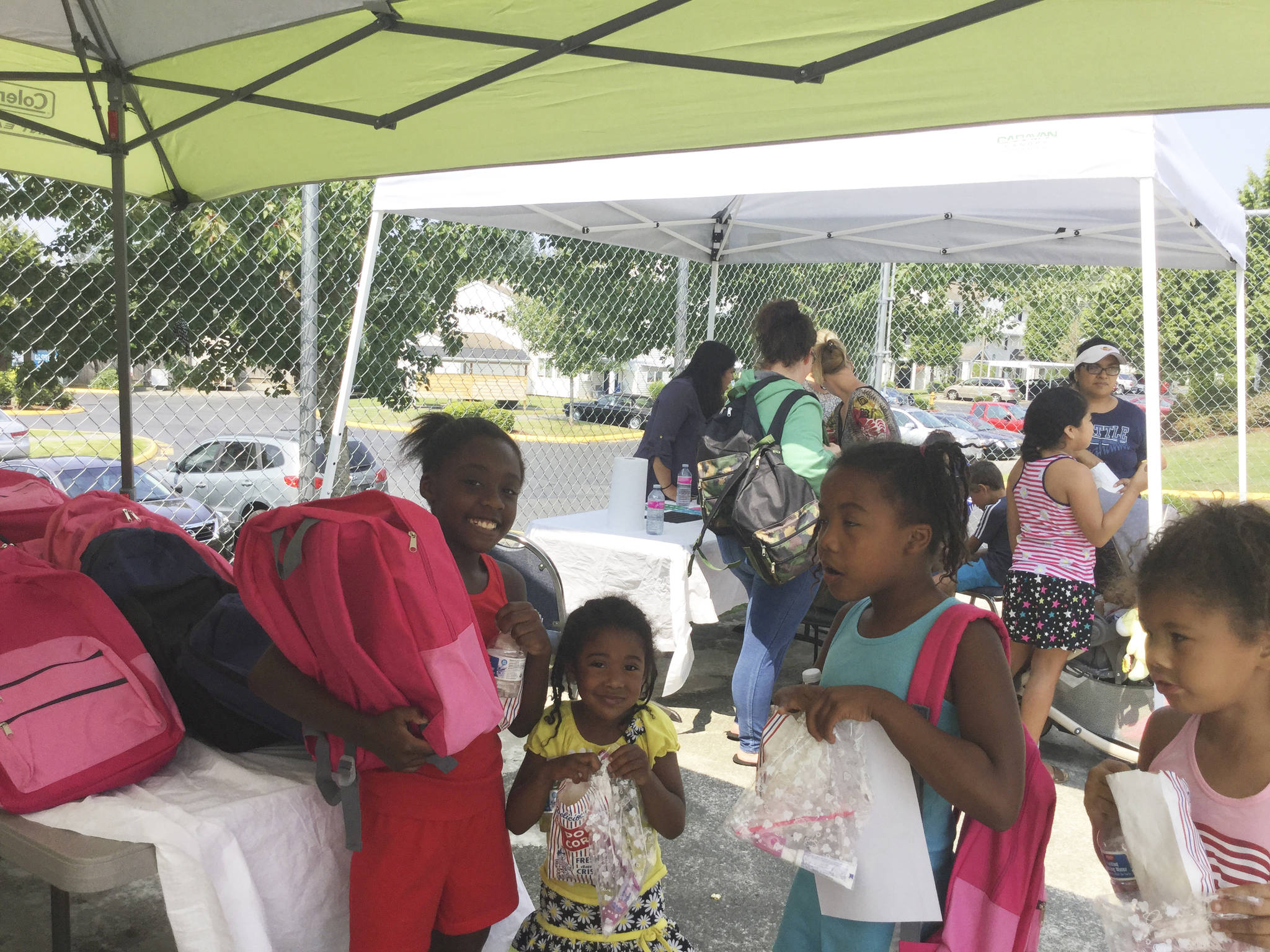 Cedars on 67th Apartments gives free back-to-school backpacks to tenant kids