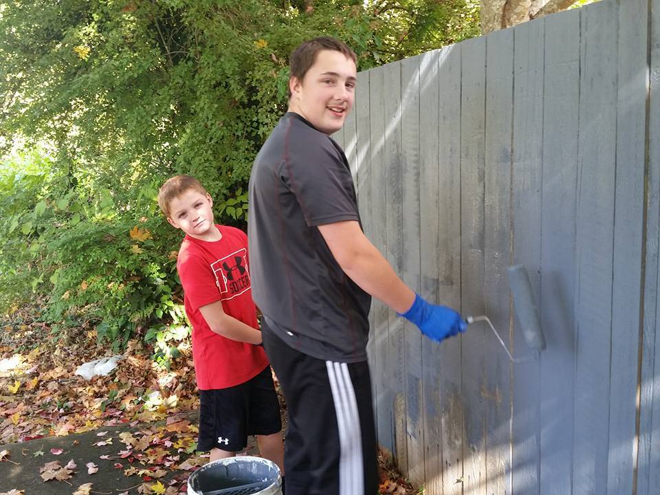 Anthany-Jay Van Volkenburg, 10 and his stepbrother Alex Nelson, 15, grabbed rollers and helped the graffiti brigade paint over tagging along a fence on 31st Avenue Oct. 8. The boys were riding by on their bikes. When they learned what the group was doing, they volunteered. Said Vikki McMurray, “I was just absolutely thrilled that young people want to be involved.”