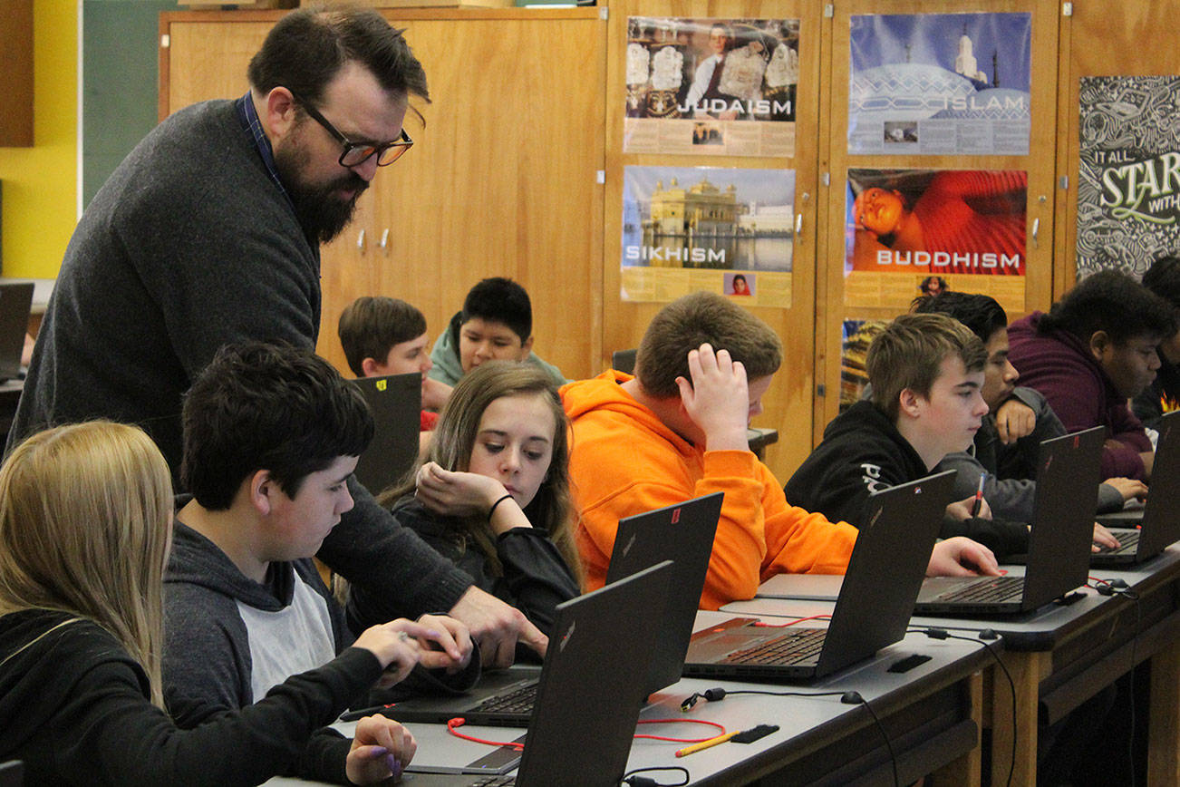 Courtesy photo                                Students use technology in an older classroom, led by teacher Nathan McGehee, in the Marysville School District.