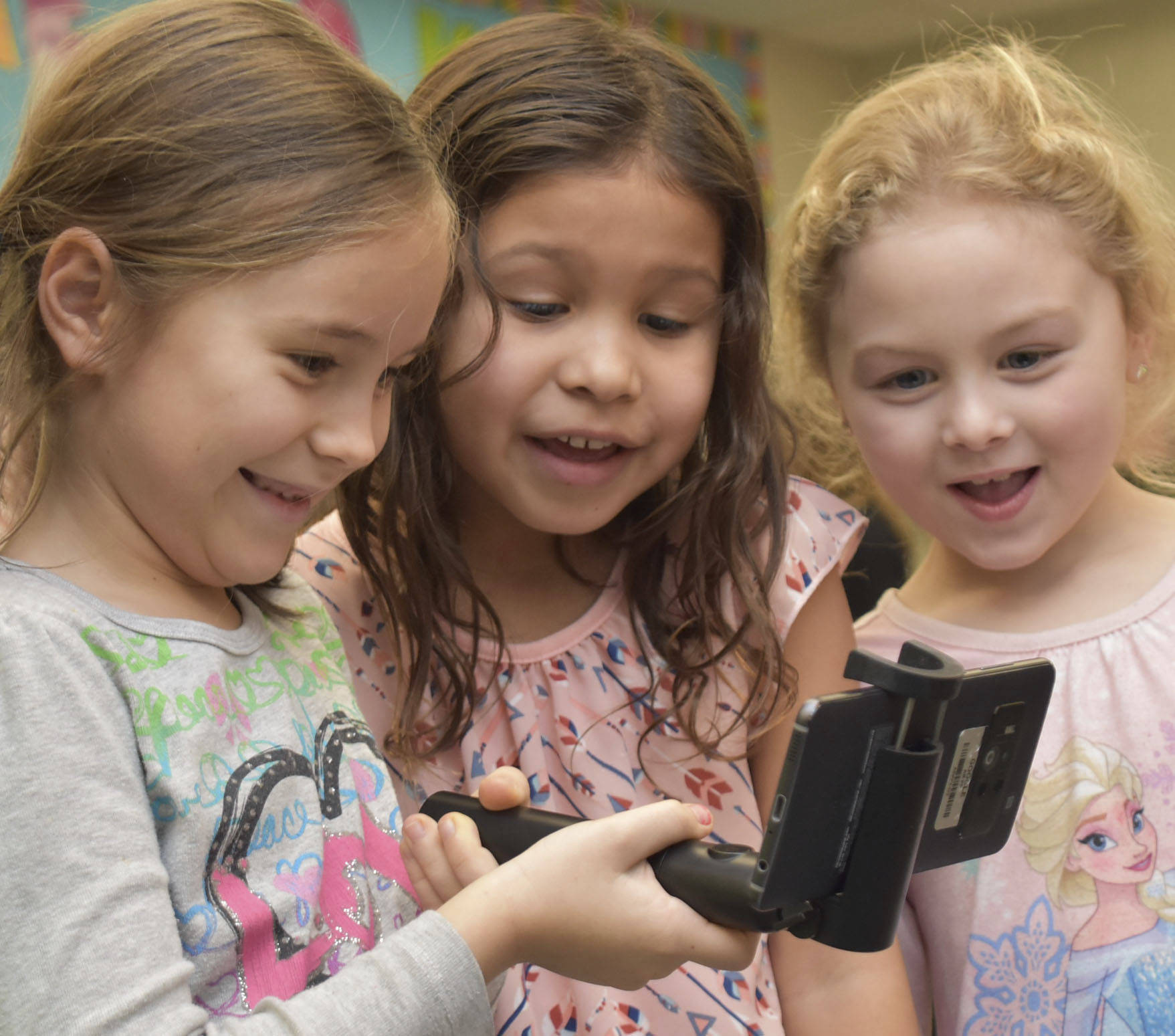 Kent Prairie Elementary first-graders react to a three-dimensional, augmented reality image of the Earth. A Google for Education representative visited the school on Feb. 9 and let the students engage with 3D objects that were placed around the school.