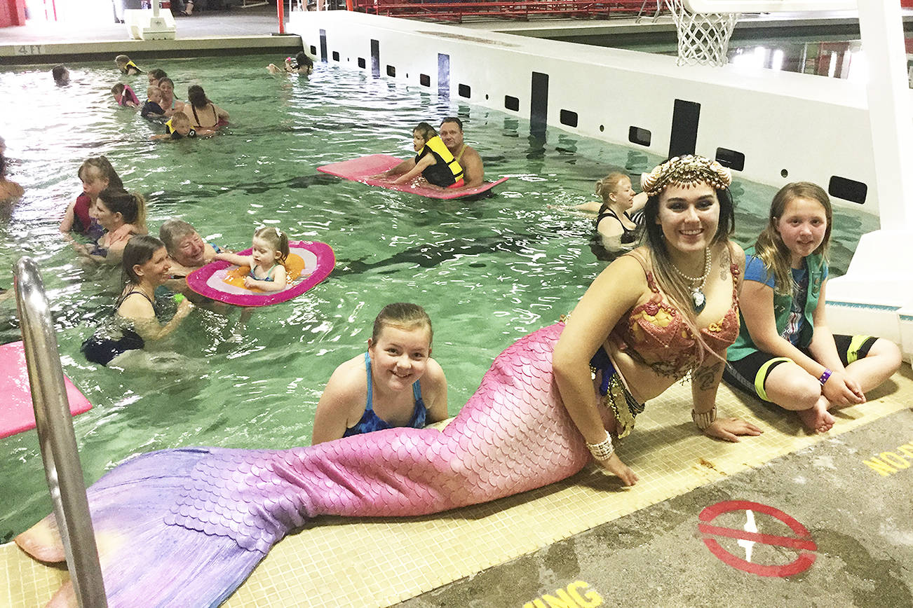 Special needs girls revel in magical swim with mermaids