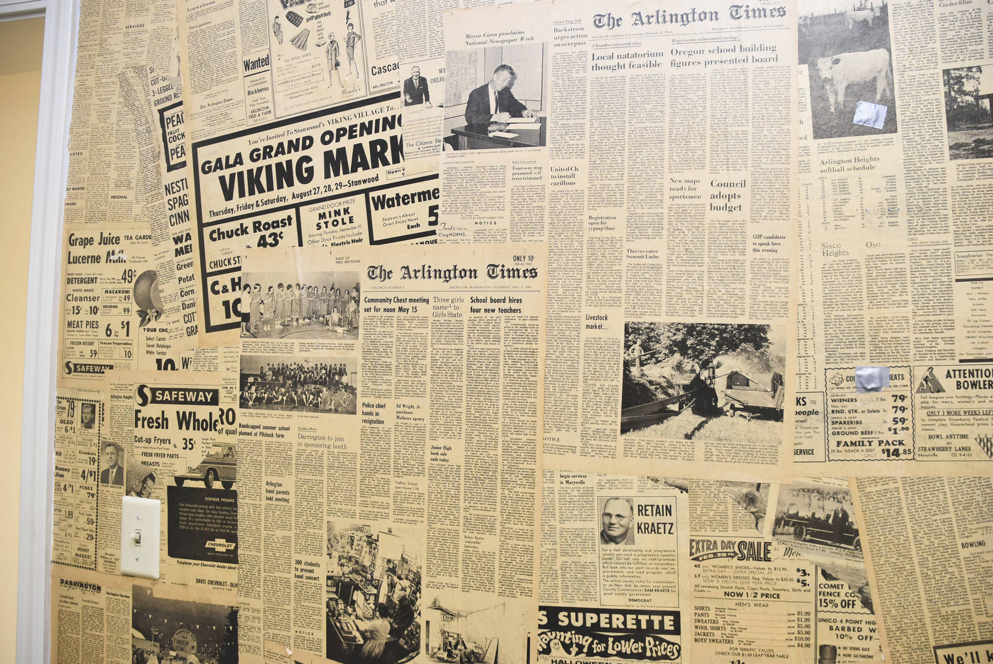 A wall in a French Avenue Support Services house that became the new location for Arlington School District’s Transition Program is wallpapered with vintage Arlington Times newsprint, offering a peek at life in 1960s Arlington. The new reading room?