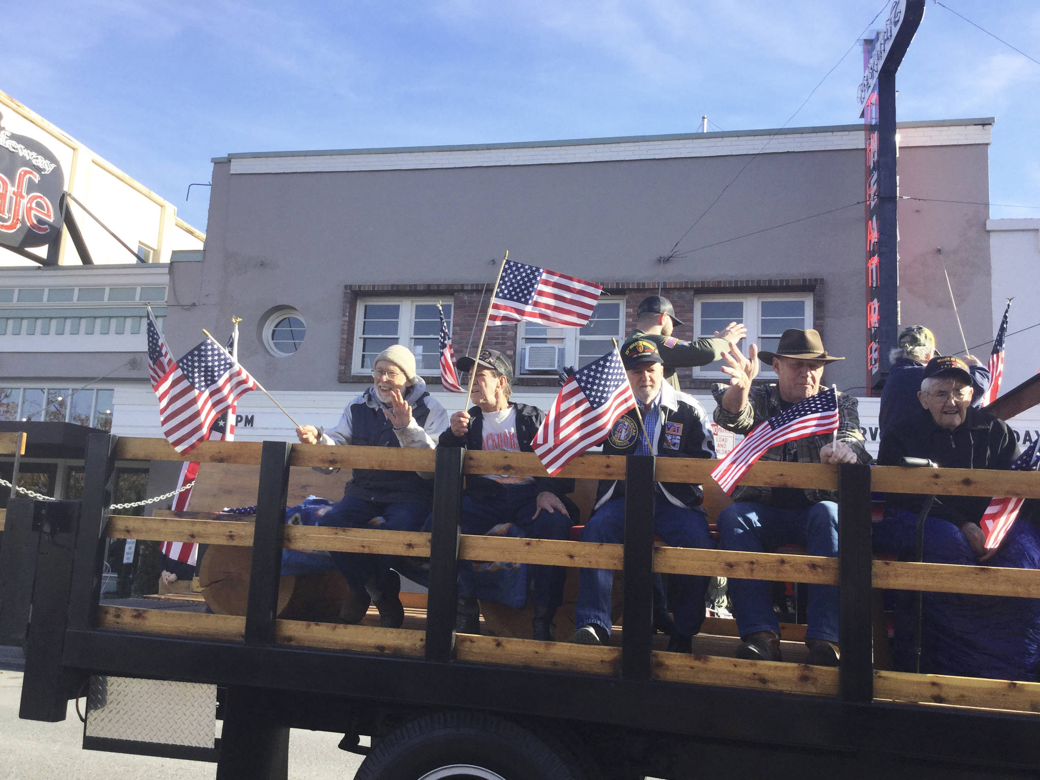 Flag-waving veterans thanked for their service from grateful parade goers at the Veterans Day Parade in Arlington Sunday.