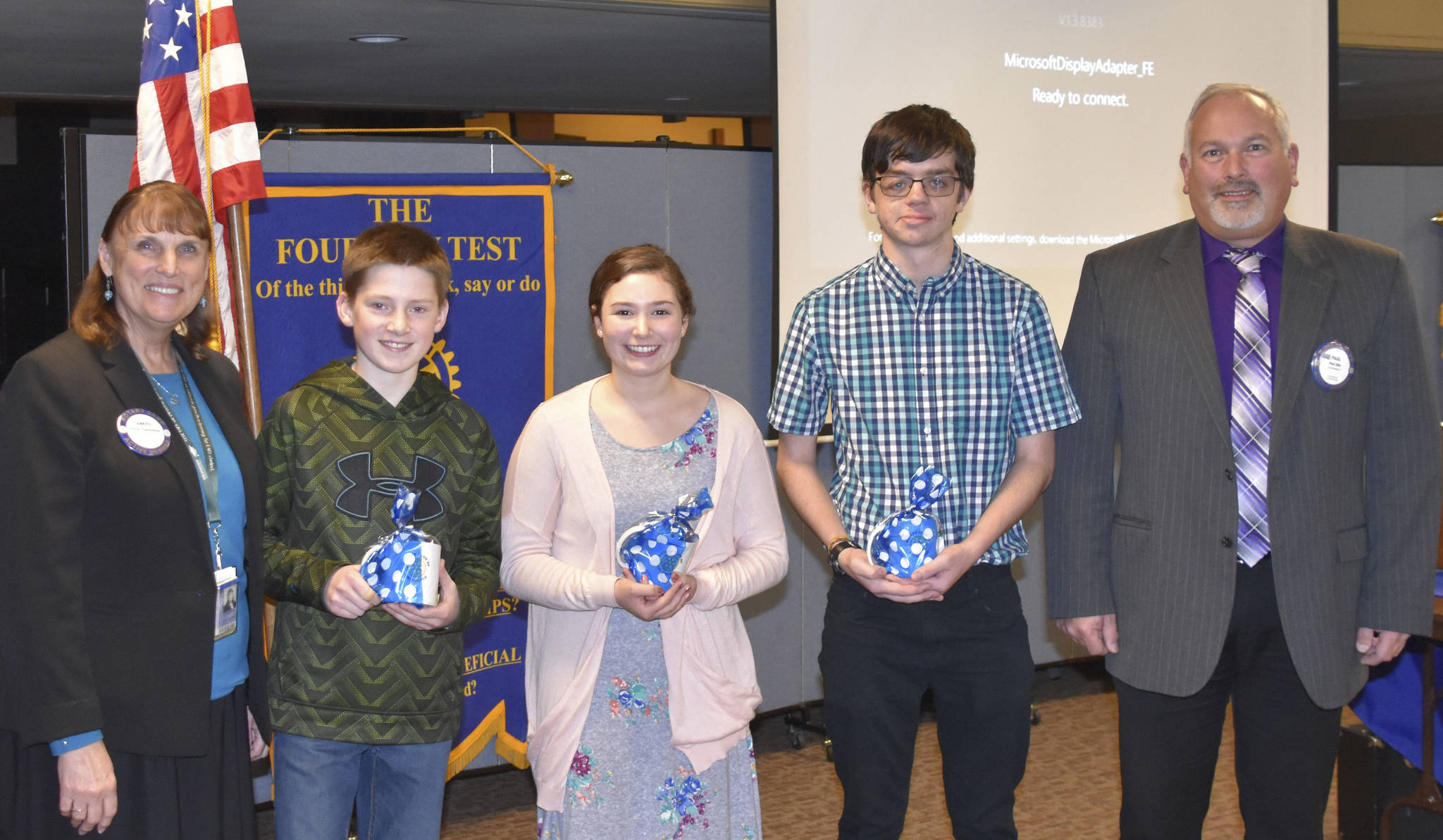 Arlington Rotary Club honored three outstanding students recently for making a difference in their school. From left, Arlington Public Schools Superintendent Chrys Sweeting; Kaden Martinsen, Post Middle School; Trinity Bowles, Haller Middle School; Aaron Holocke, Weston High School; and Rotary President Paul Ellis.