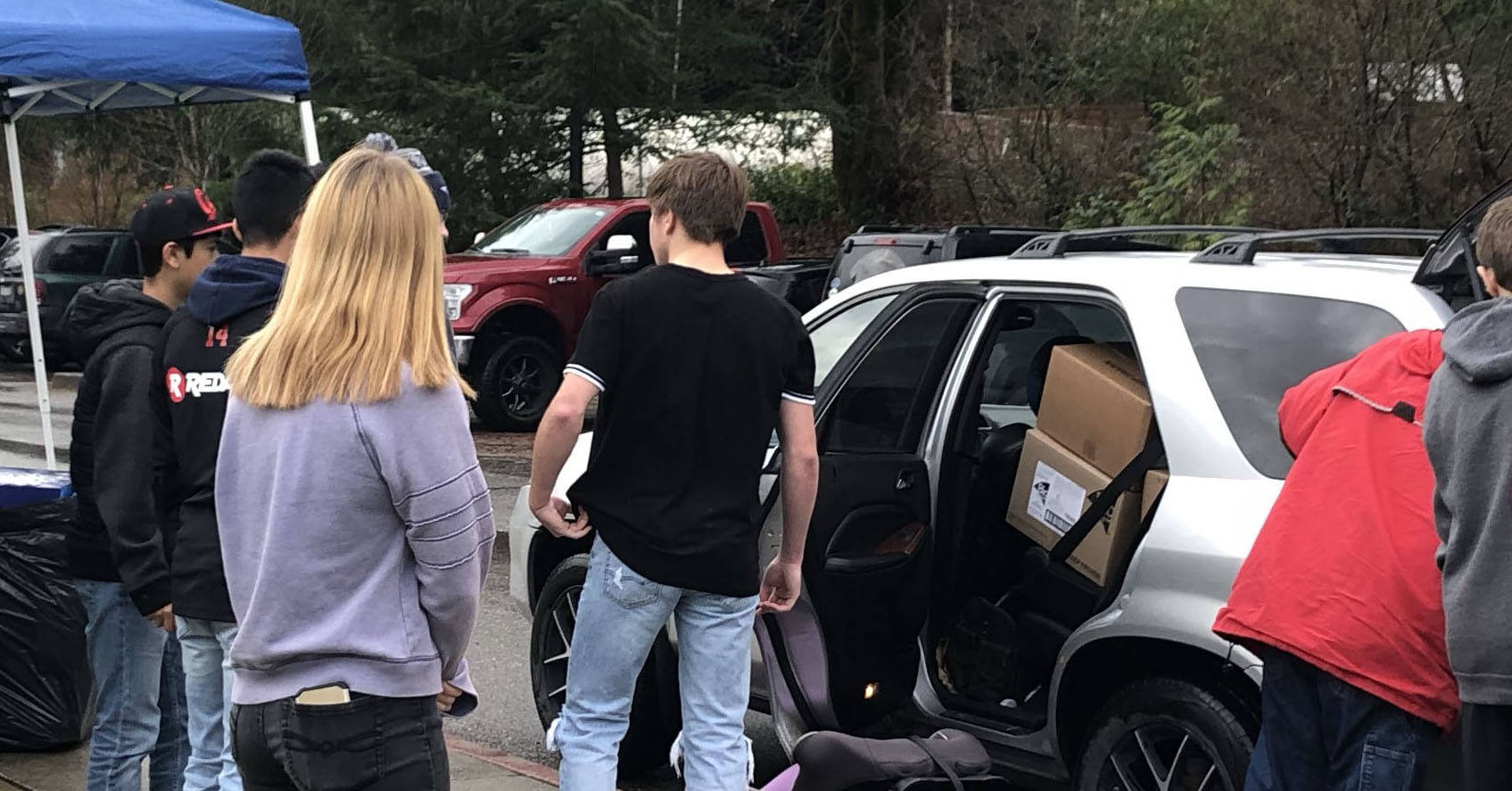 Arlington DECA raises money, more to help families, food bank