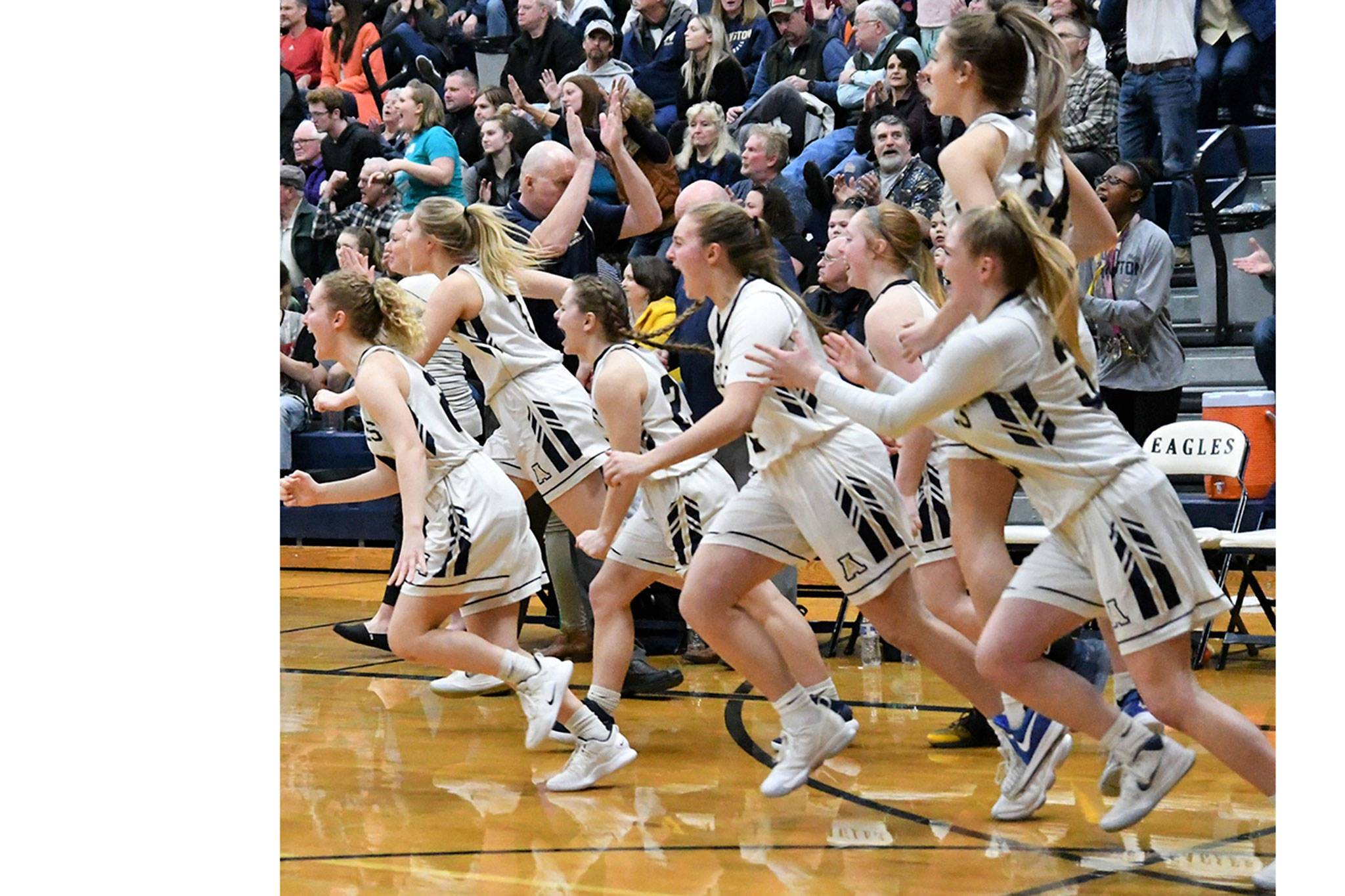 Eagle girls win thriller; local wrestlers advance to regionals