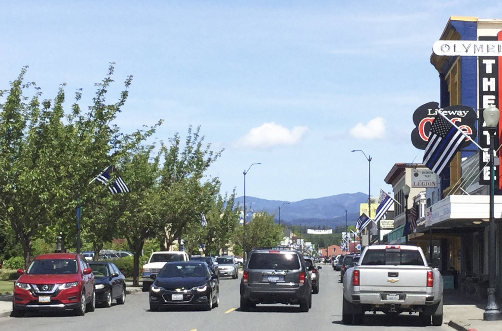 Commemorative Thin Blue Line flags flew along both sides of Olympic Avenue in Arlington May 12-18 to signal Police Week, which honors law enforcement fallen officers while supporting those still active in the line of duty. Arlington-based R Transport Inc. bought and donated the flags, which were installed by the city Maintenance and Operations Department. It brought a tear to my eye and several of the officers to see that community support, and quite honestly weve seen officers come from out of state and outside the area just to drive here and take photos, so it has really touched people far and wide, Police Chief Jonathan Ventura said.