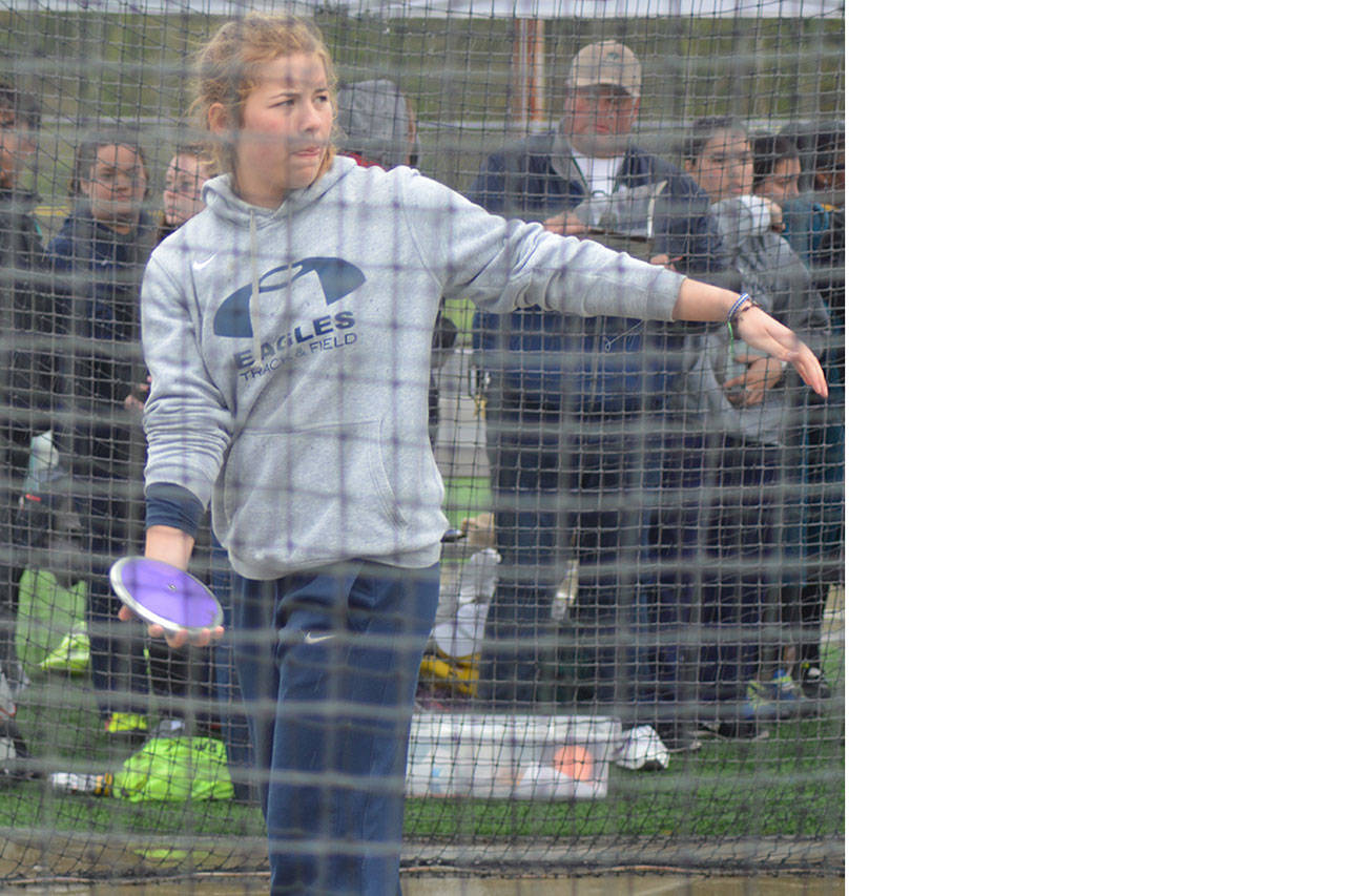 Julia Parra of Arlington, shown here at a meet earlier this spring, placed third at state in the discus Thursday. (Steve Powell/File Photo)