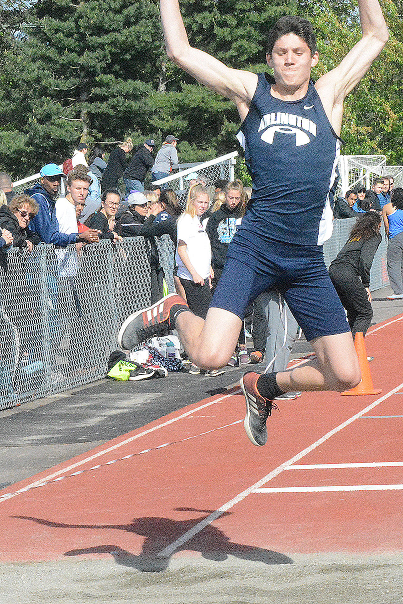 Joshua Gutierrez of Arlington, shown here competing in the triple jump last week at districts in Shoreline, was eighth in state in that event Thursday. (Steve Powell/File Photo)