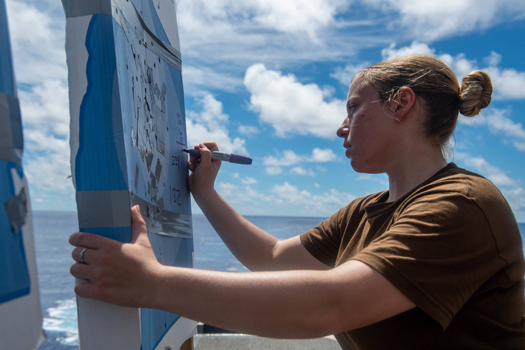 Kimberly Herbert of Marysville on deck of the ship keeping score in the gun qualification course. (Courtesy Photo)