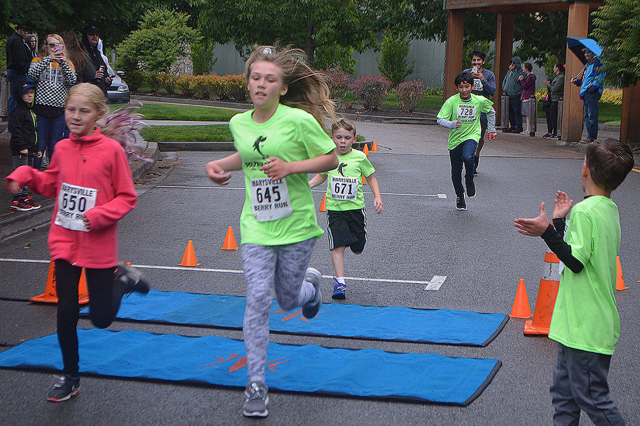 Dylan Mendes, 11, placed 14th in the one-mile race at the Berry Run, just behind Melissa Sather, 10, who was 13th. (Steve Powell/Staff Photo)