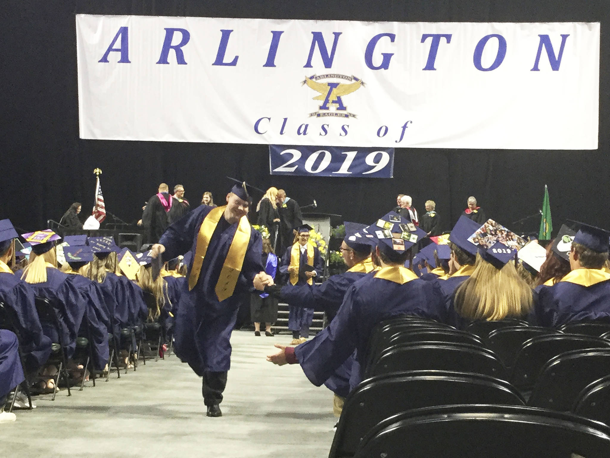 Arlington High School seniors celebrate receiving their diplomas.