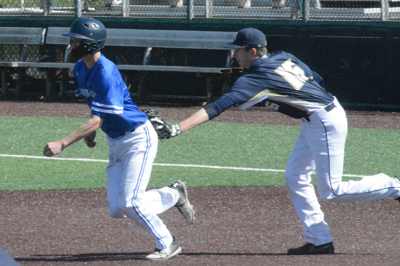 Steve Powell/File Photo                                 Ben Spores tags out a runner in a game this year.