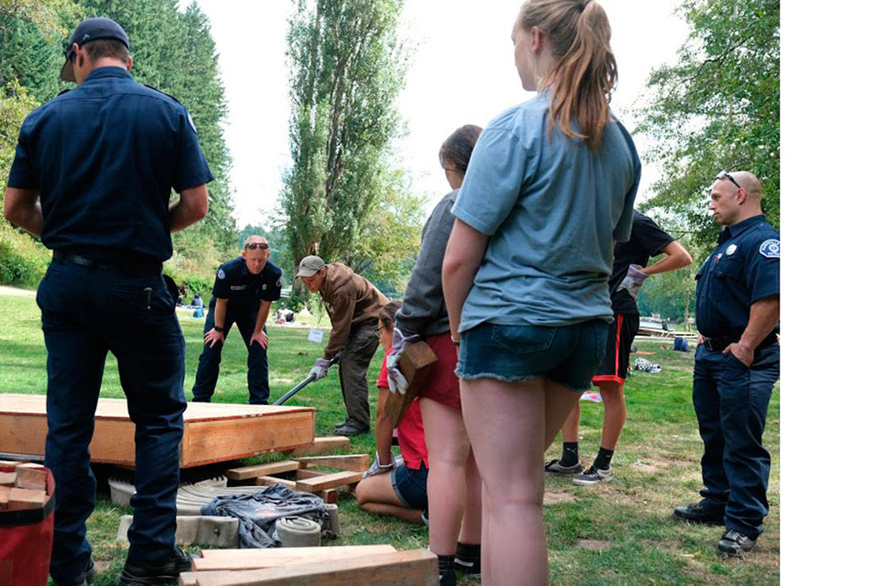 Left to right, Marysville firefighters Ben Williams, Dakota Herrington and Dustin Jensen show how to leverage something off of a victim.