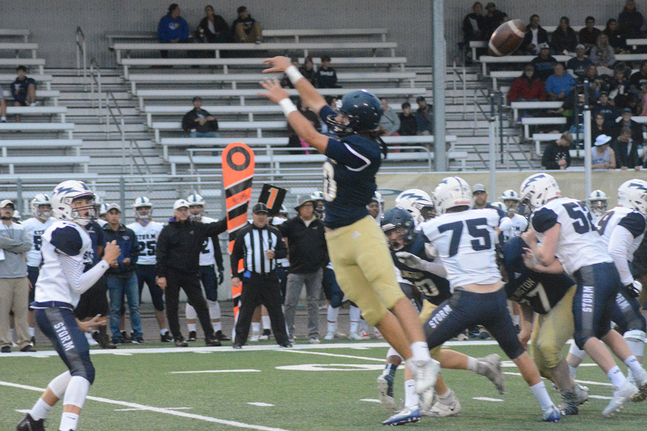 Eagle linebacker Michael Tsoukalas, shown here breaking up a pass play the previous week, had a fumble return for a TD and an interception Friday. (File Photo)