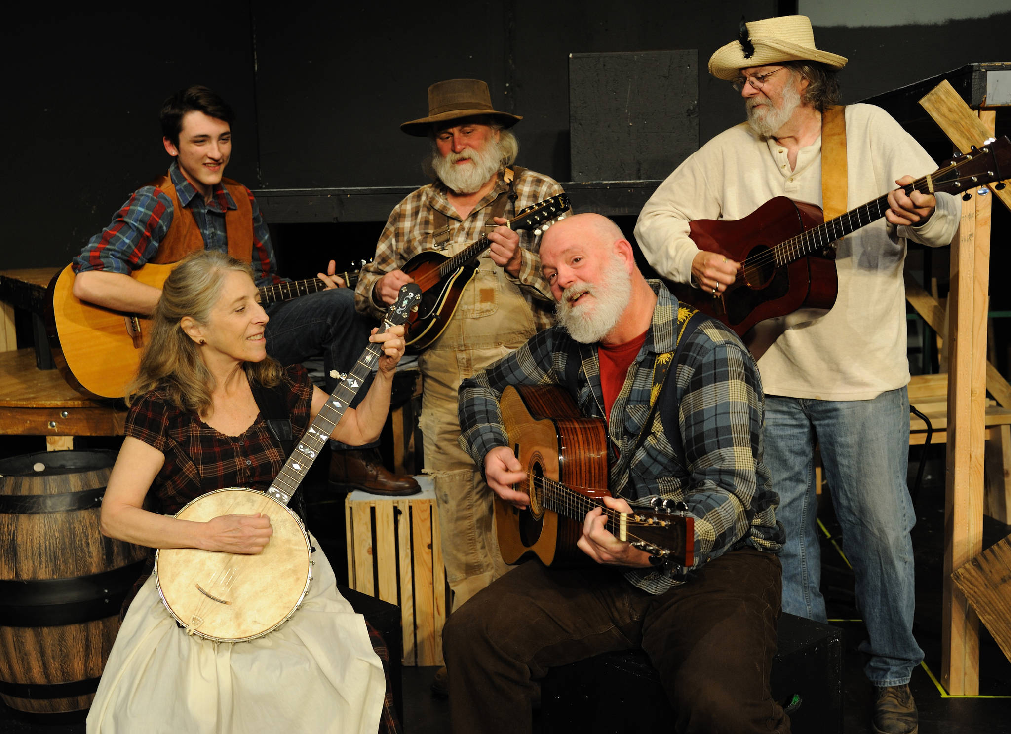 The actors/musicians who provide the musical backdrop for Dark of the Moon Drew Winston, left, Dyann Arthur, James Prater, Bill Pfleging, and Joe Goins.