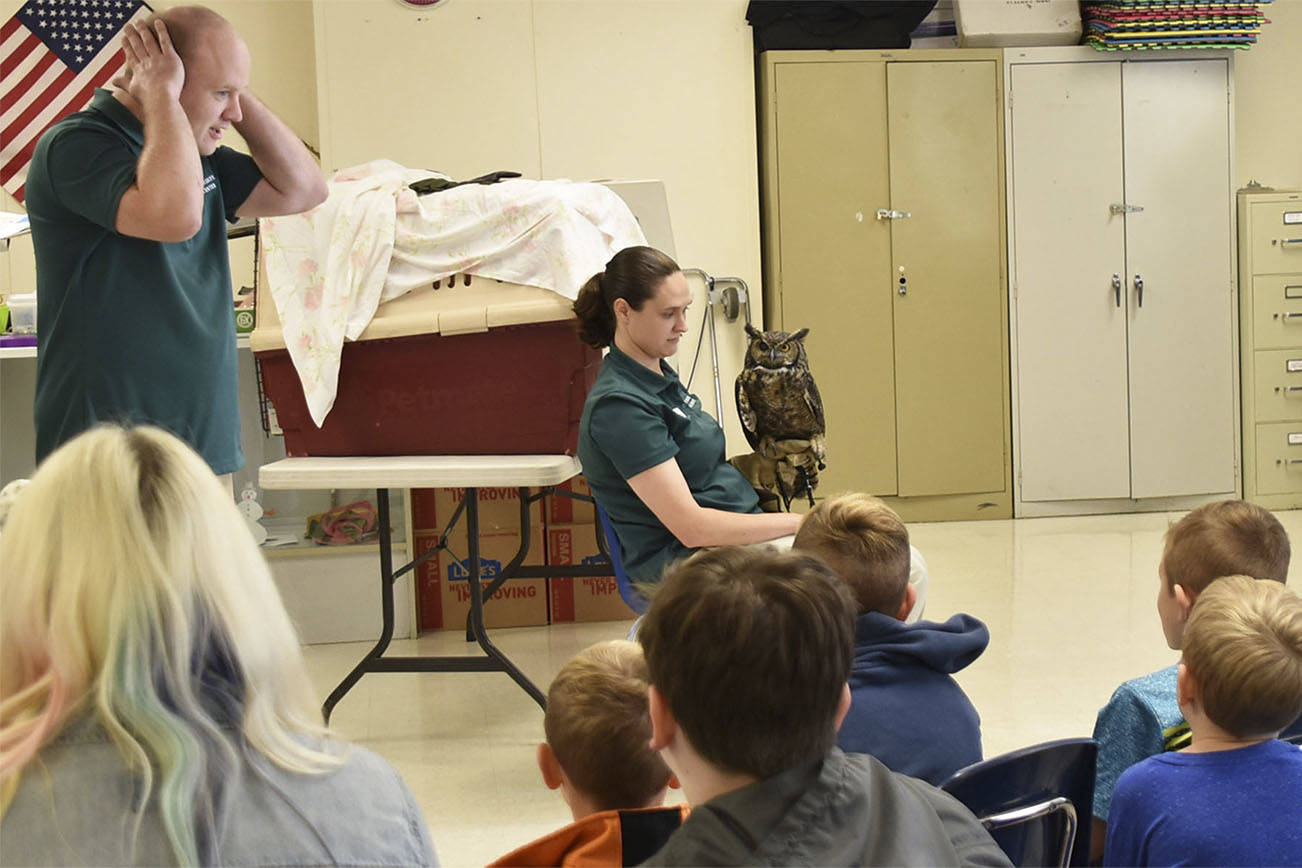Arlington science students get up close with exotic animals on wings of book learning